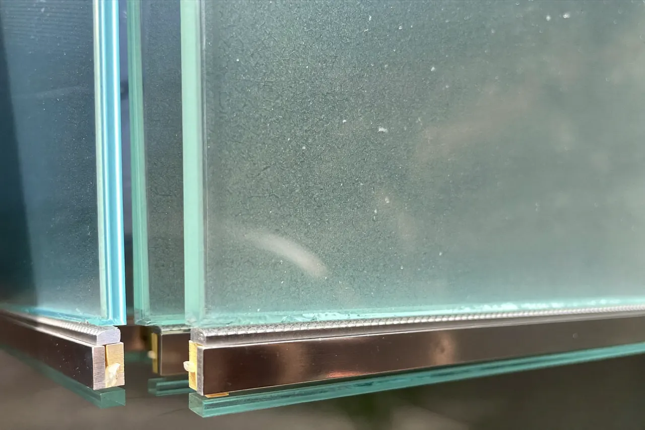Close-up of low-E coated double glazing reflecting daylight